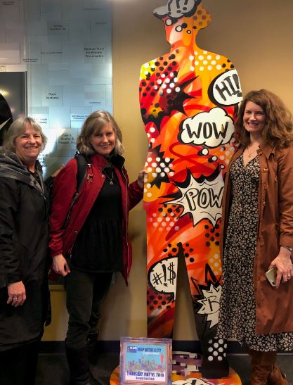 Barbara Israel, Marie O'Neill, and Carol Gray with the NSO lobby Man in the City